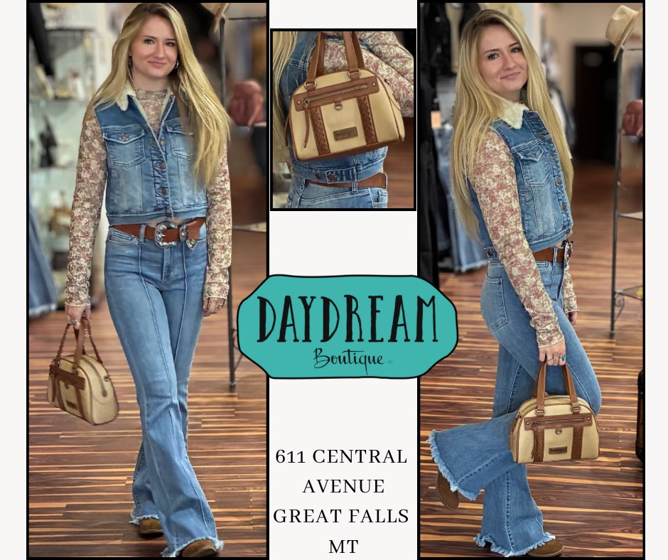 Woman in denim outfit holding a handbag at Daydream Boutique in Great Falls, MT.