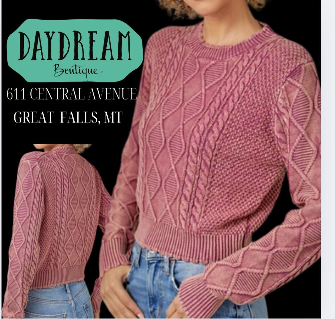 Pink cable-knit sweater from Daydream Boutique, shown on a person. Shop address in Great Falls, MT.