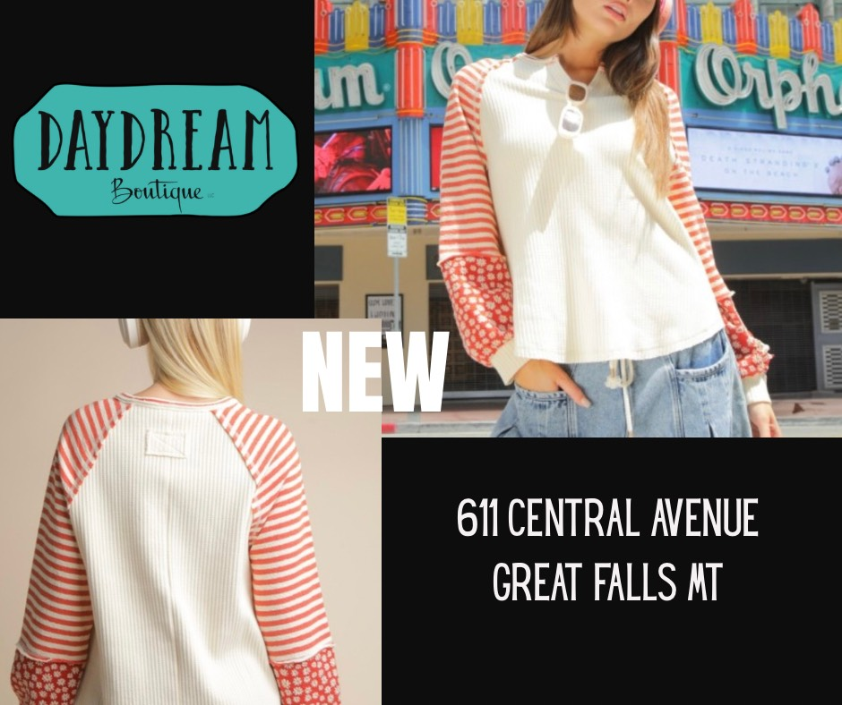 Daydream Boutique ad: Woman in beige top with patterned sleeves. Store address on black background.