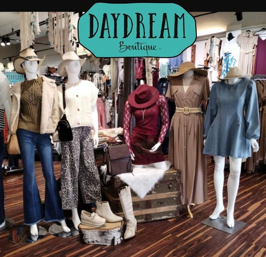 Mannequins displaying clothing inside 