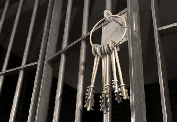 A bunch of keys hanging from a prison cell