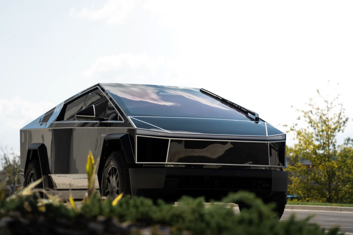 Cybertruck wrapped in custom gloss black PPF, featuring 3M reflective pinstriping on all the bevels 