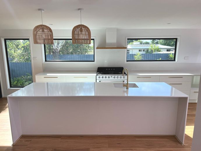 There Is A Large Island In The Middle Of The Kitchen — Miss Bright Cleaning Services In Mount Isa City, QLD