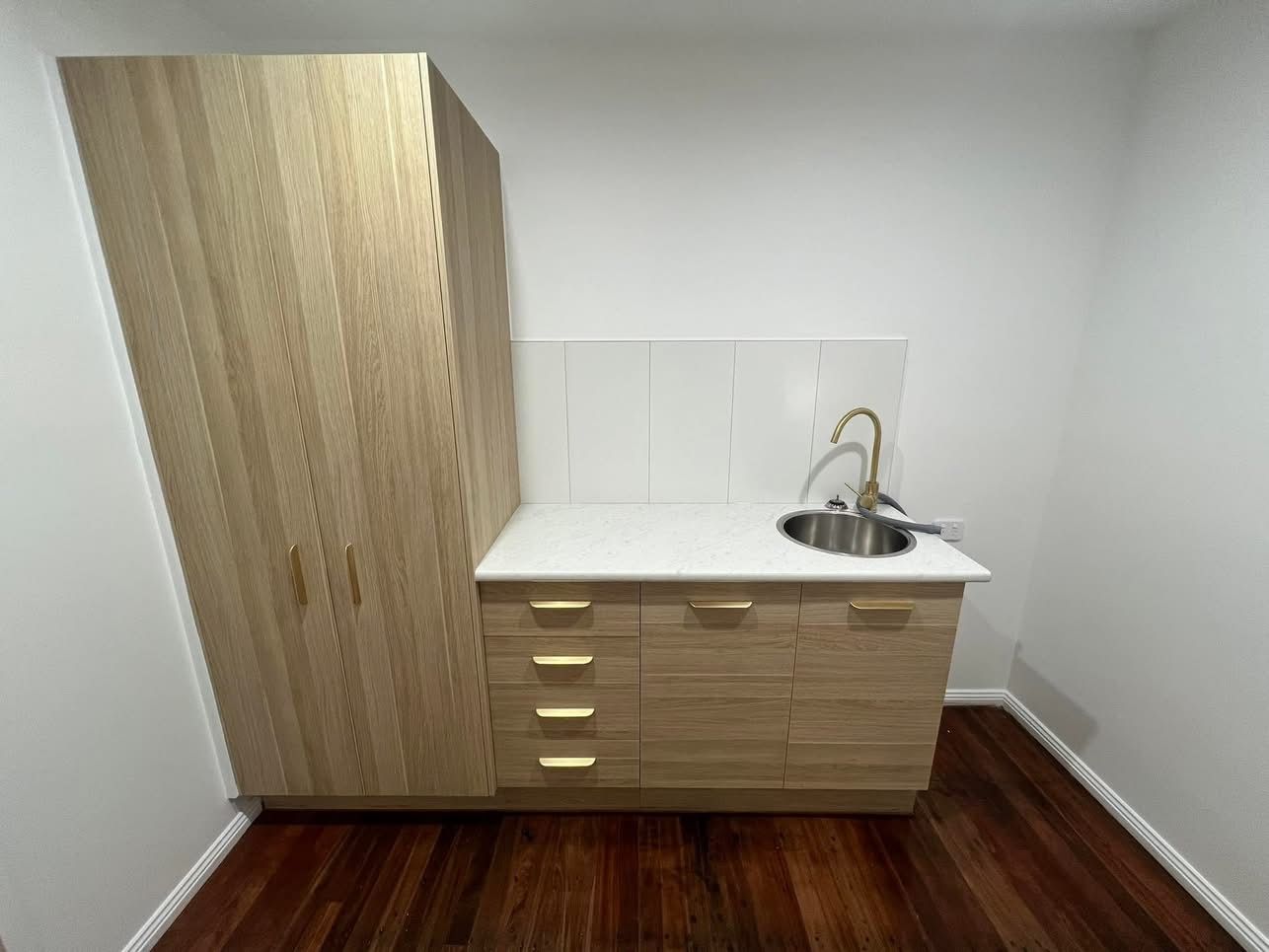 An Empty Room With Hardwood Floors and French Doors — Miss Bright Cleaning Services In Mount Isa City, QLD