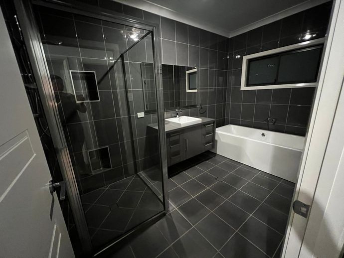 White Cabinet With a Shelf Underneath It — Miss Bright Cleaning Services In Mount Isa City, QLD A White Cabinet With a Shelf Underneath It — Miss Bright Cleaning Services In Mount Isa City, QLD