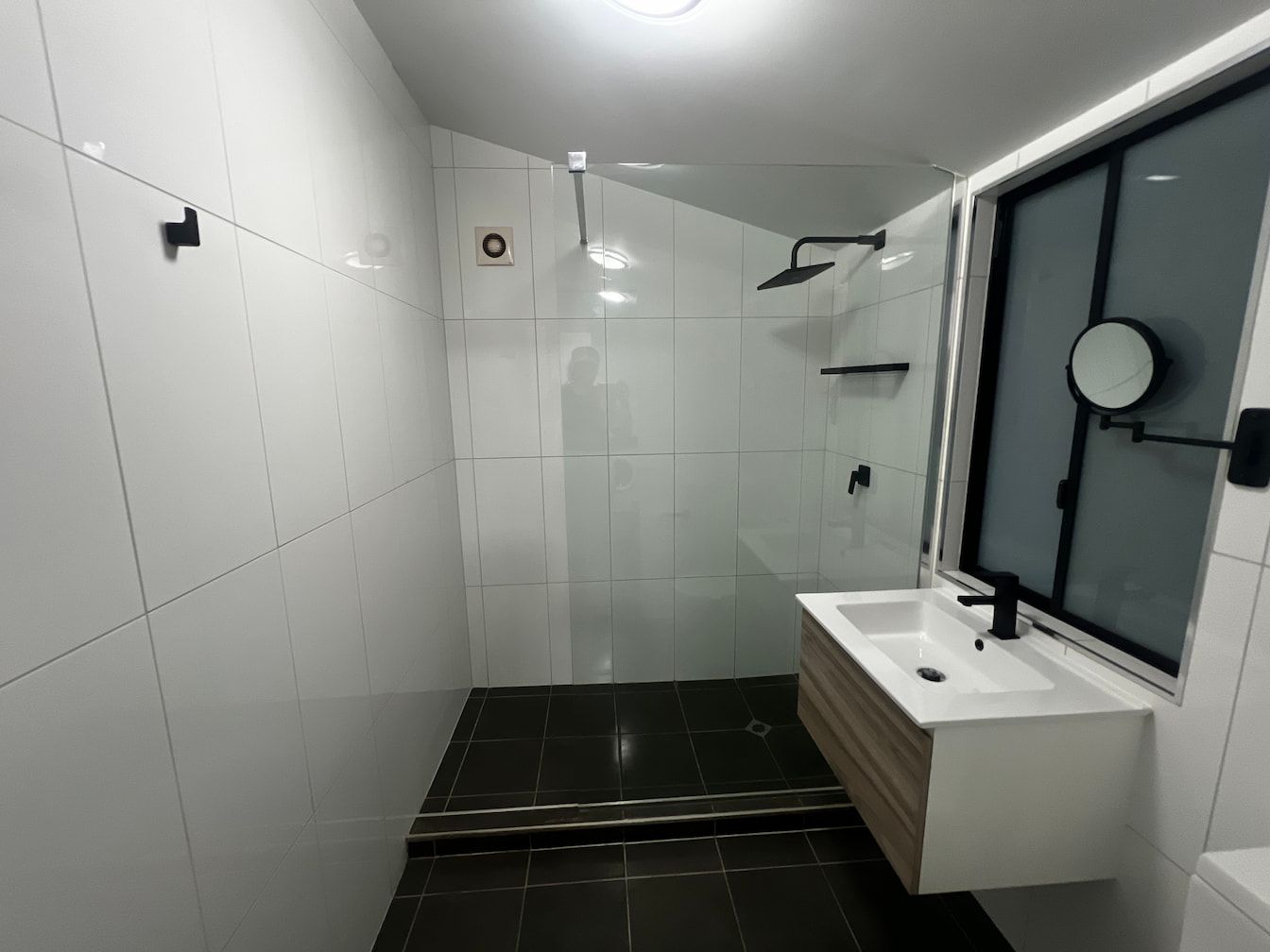 A Bathroom With A Sink , Mirror And Shower — Miss Bright Cleaning Services In Mount Isa City, QLD