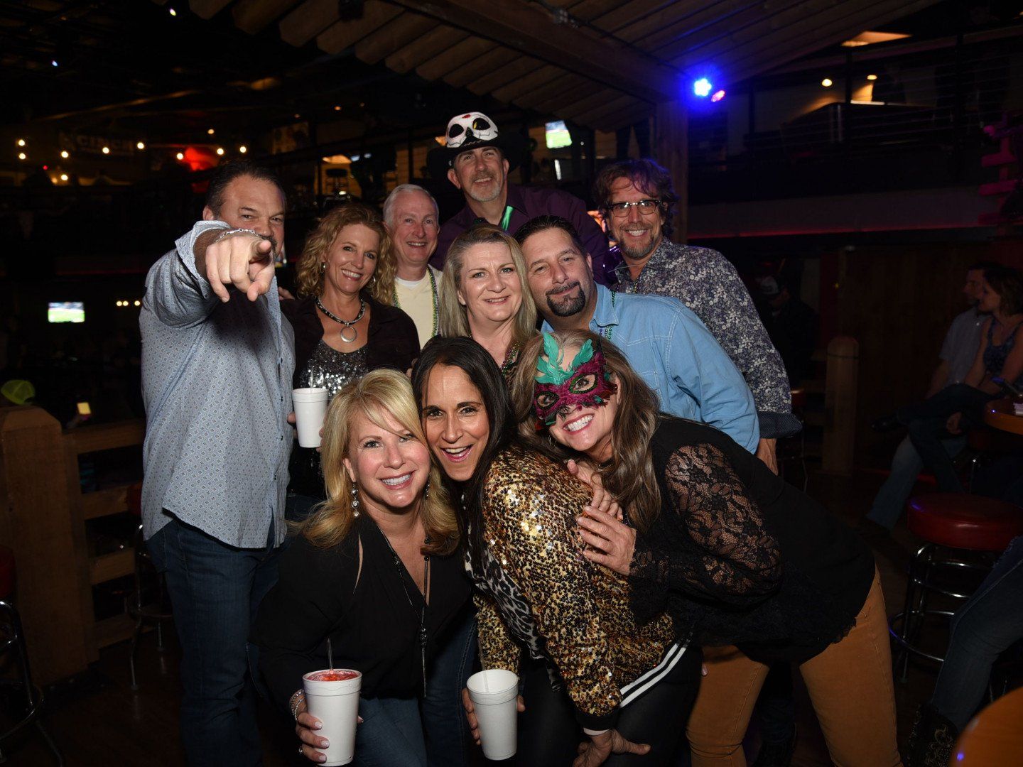group of people having fun and posing for camera at a nightclub