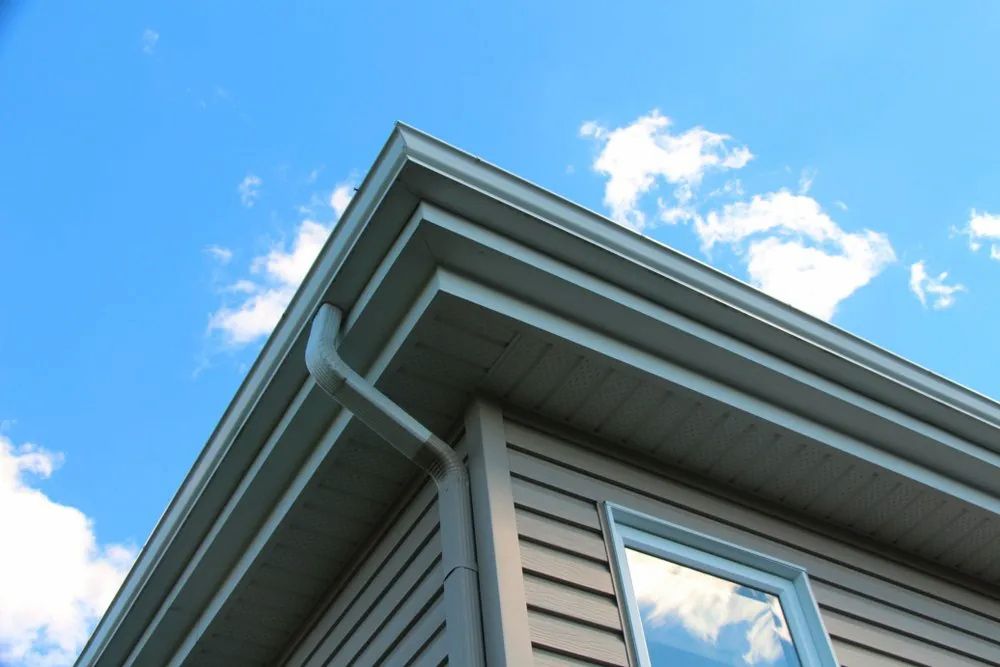 Looking Up at the Roof of a House With a Blue Sky in the Background — Ron Nickel Roofing in Tweed Heads South, NSW