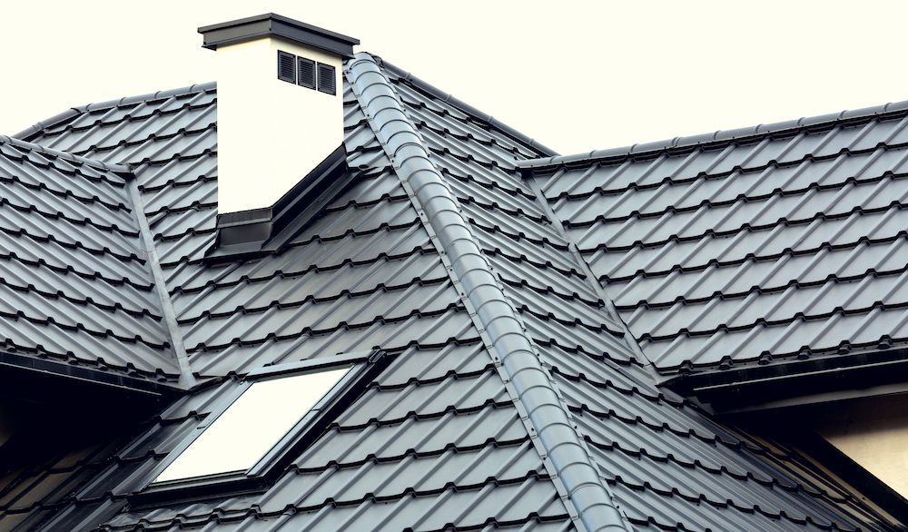 A Roof With a Chimney and a Skylight on It — Ron Nickel Roofing in Tweed Heads South, NSW