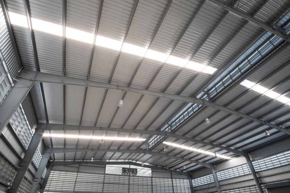 The Inside of a Large Warehouse With a Metal Roof — Ron Nickel Roofing in Murwillumbah, NSW