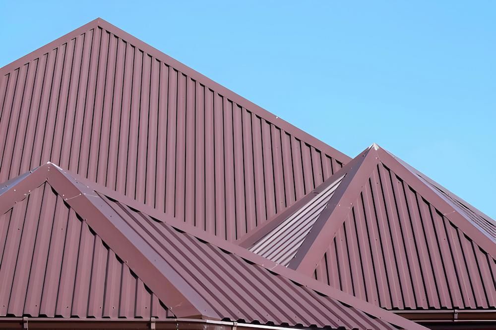A Brown Roof With a Blue Sky in the Background — Ron Nickel Roofing in Palm Beach, QLD