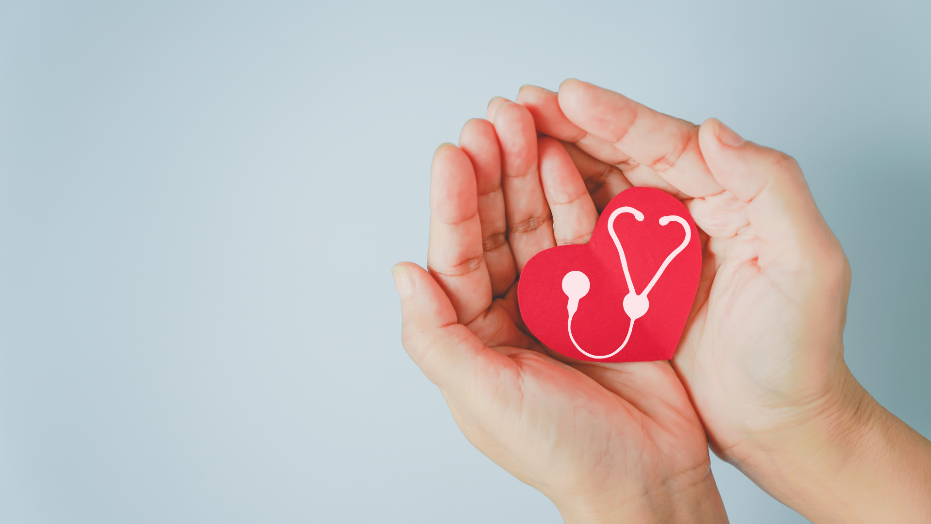 A man and a woman are sitting next to each other and smiling.