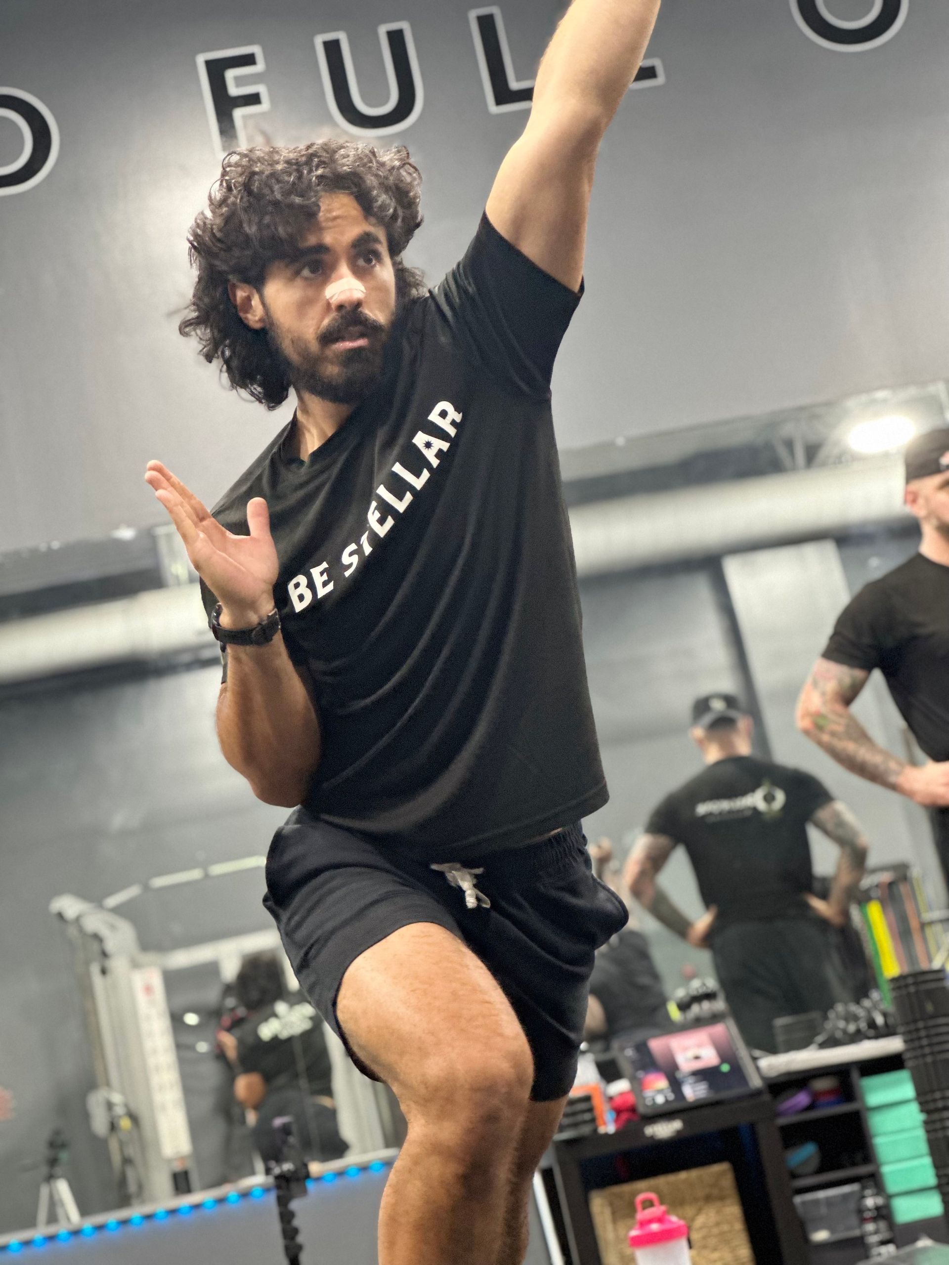 A man in a black shirt with the word bestseller on it