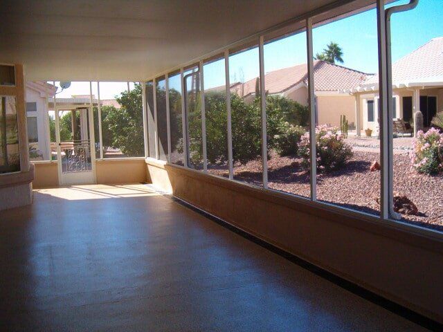 Epoxy concrete coating with chips with enclosed patio cover Sun City 4