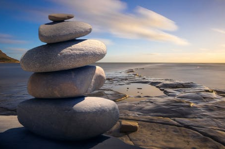Photo of stones stacked on a seashore