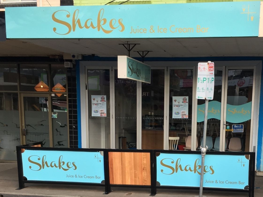 A restaurant with a sign that says shakes on it