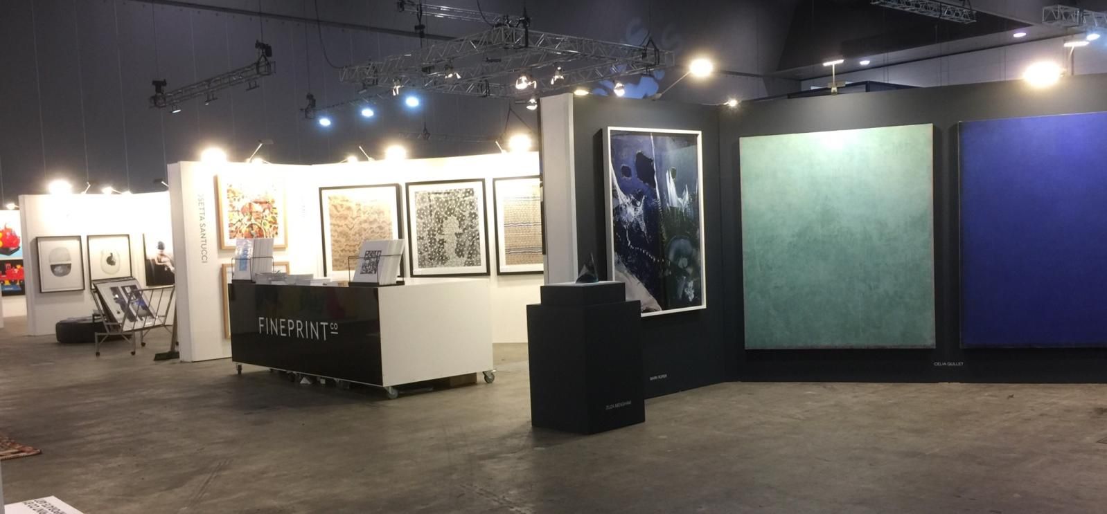 A large room with a lot of paintings on the wall.