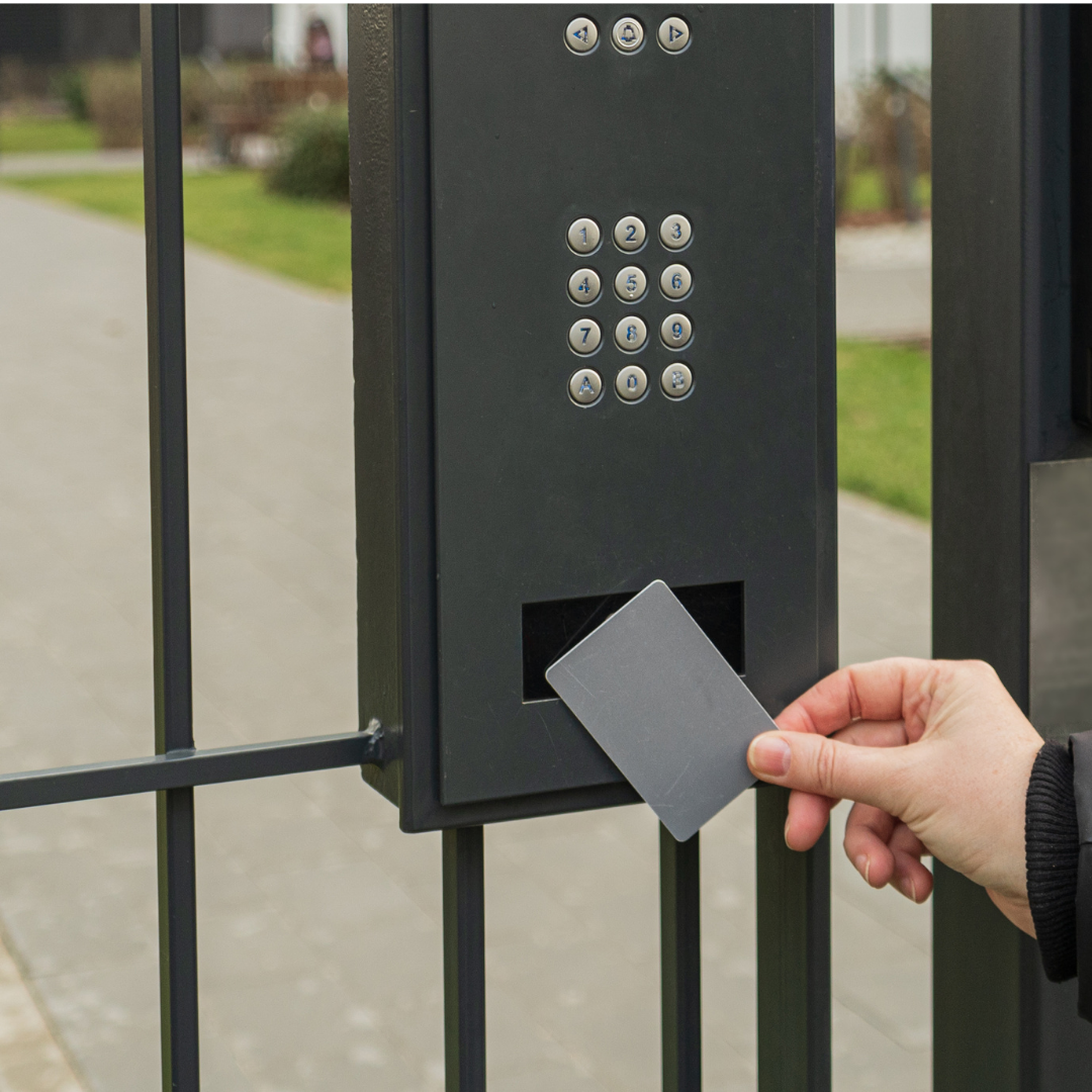 A person is inserting a card into a keypad
