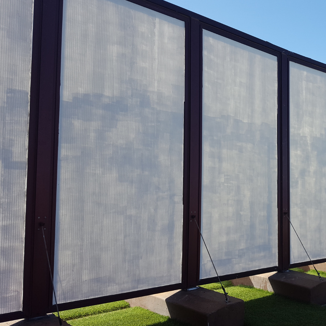 a black railing is being installed on the side of a house .