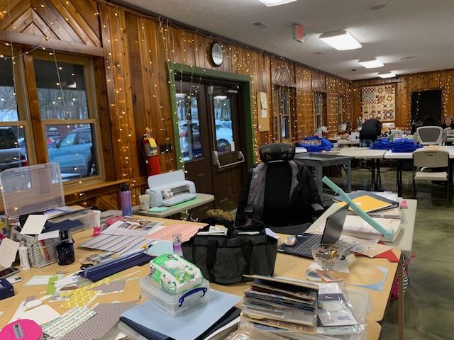 A messy office with a clock on the wall