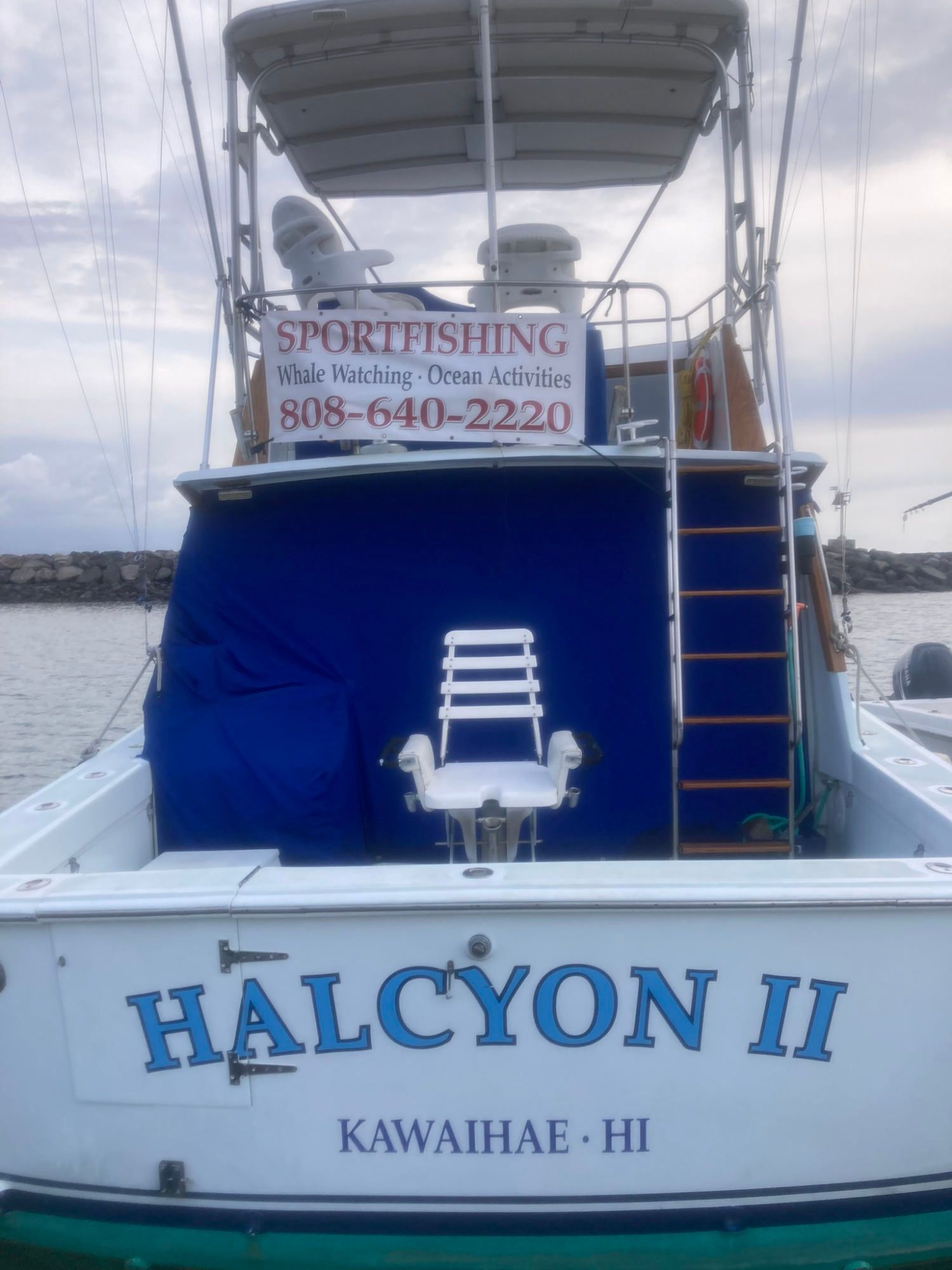 A boat with the name halcyon ii on the back