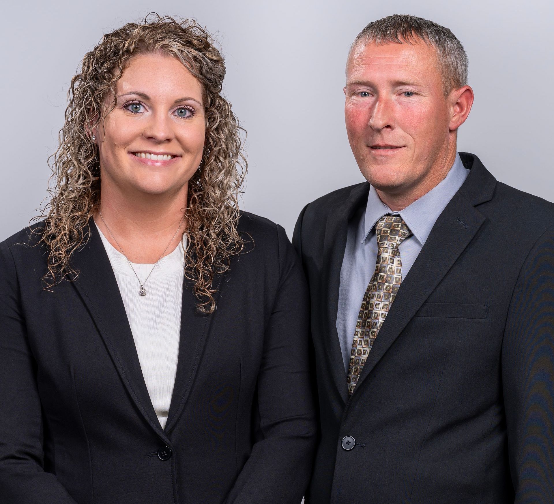 a man and a woman are posing for a picture together