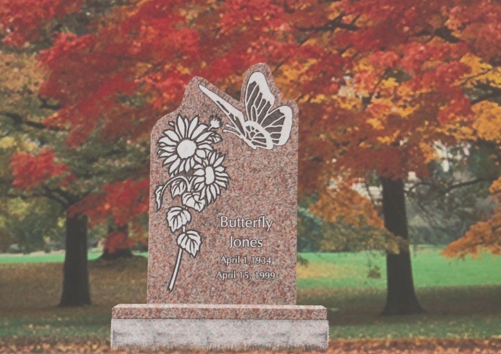 a sunset over a mountain range with a cloudy sky