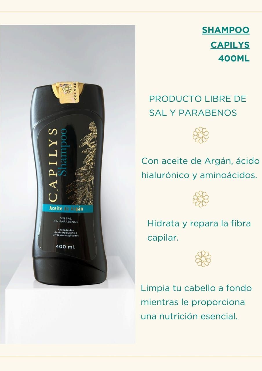 Una botella de champú está encima de una mesa blanca.