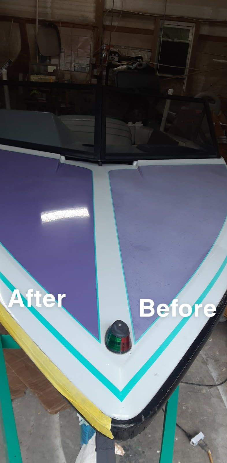 A boat bow showing a side-by-side comparison of old faded purple paint on the right and fresh, bright purple on the left.