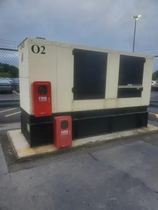 A large beige generator labeled 