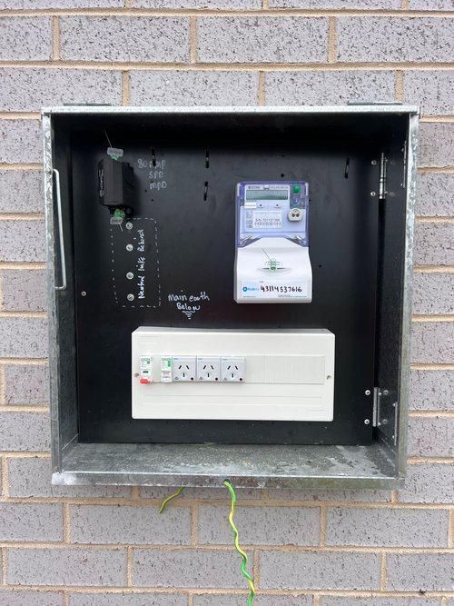 A Box on a Brick Wall Has a Meter on It — JMB Electrical Services In Port Kembla, NSW