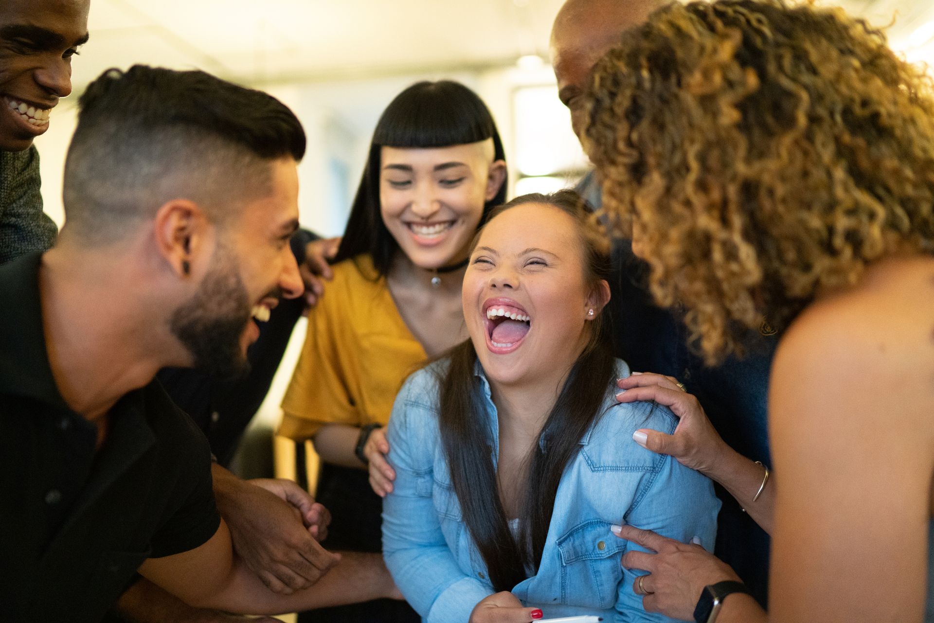 A group of people laughing together.