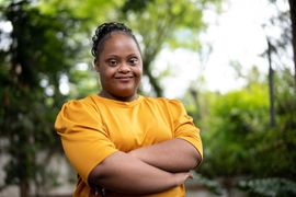 a lady wearing a yellow shirt