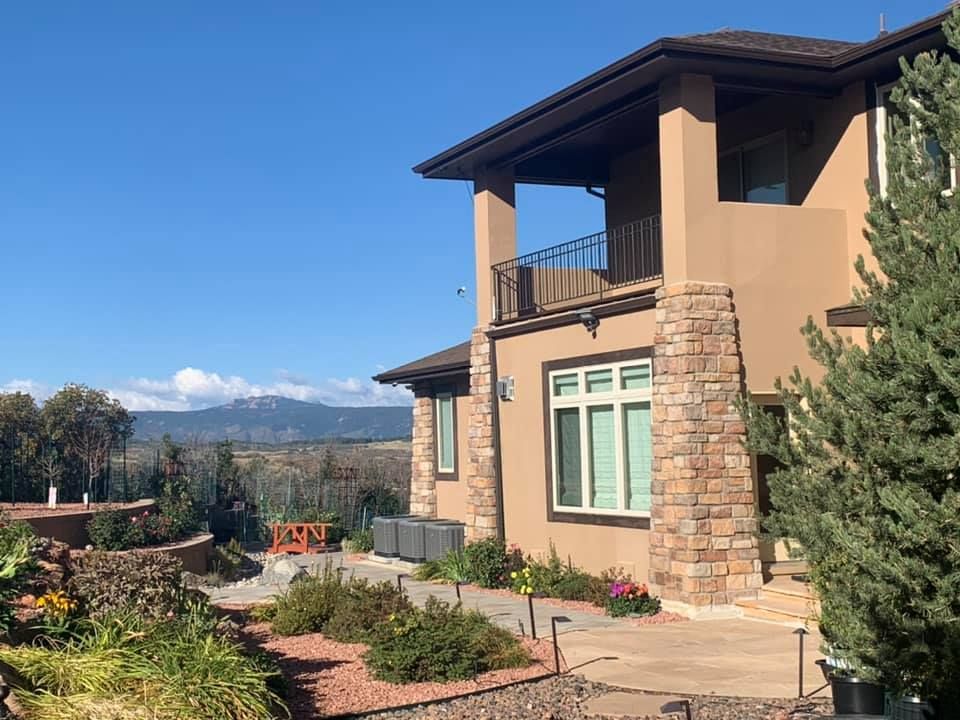 A large house with a lot of windows and a balcony