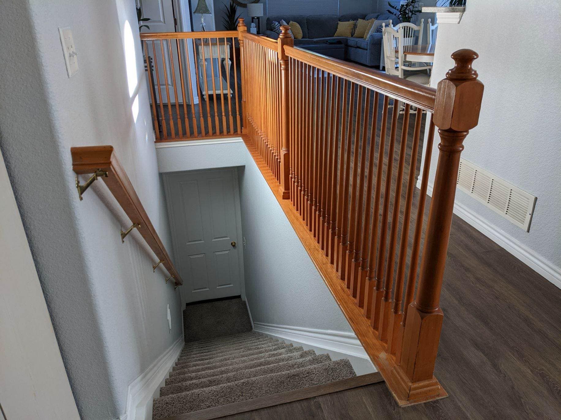 A wooden staircase leading up to the second floor of a house.