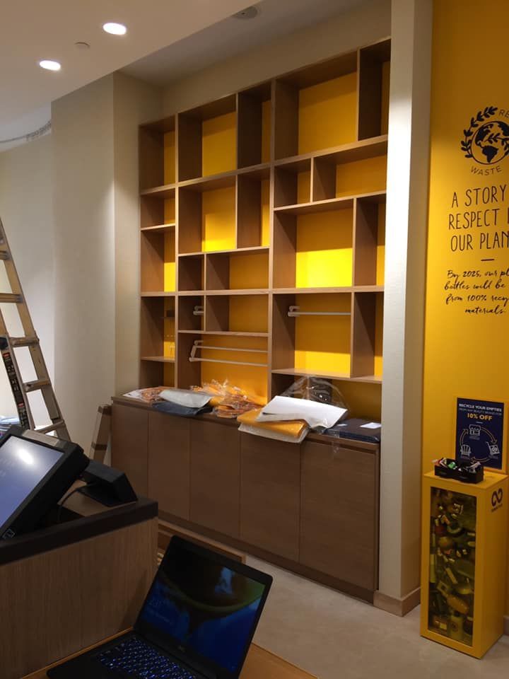 A room with shelves and a sign that says a story respect our planet