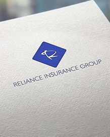 Reliance Insurance Group logo on white textured paper. Blue diamond with white abstract symbol.