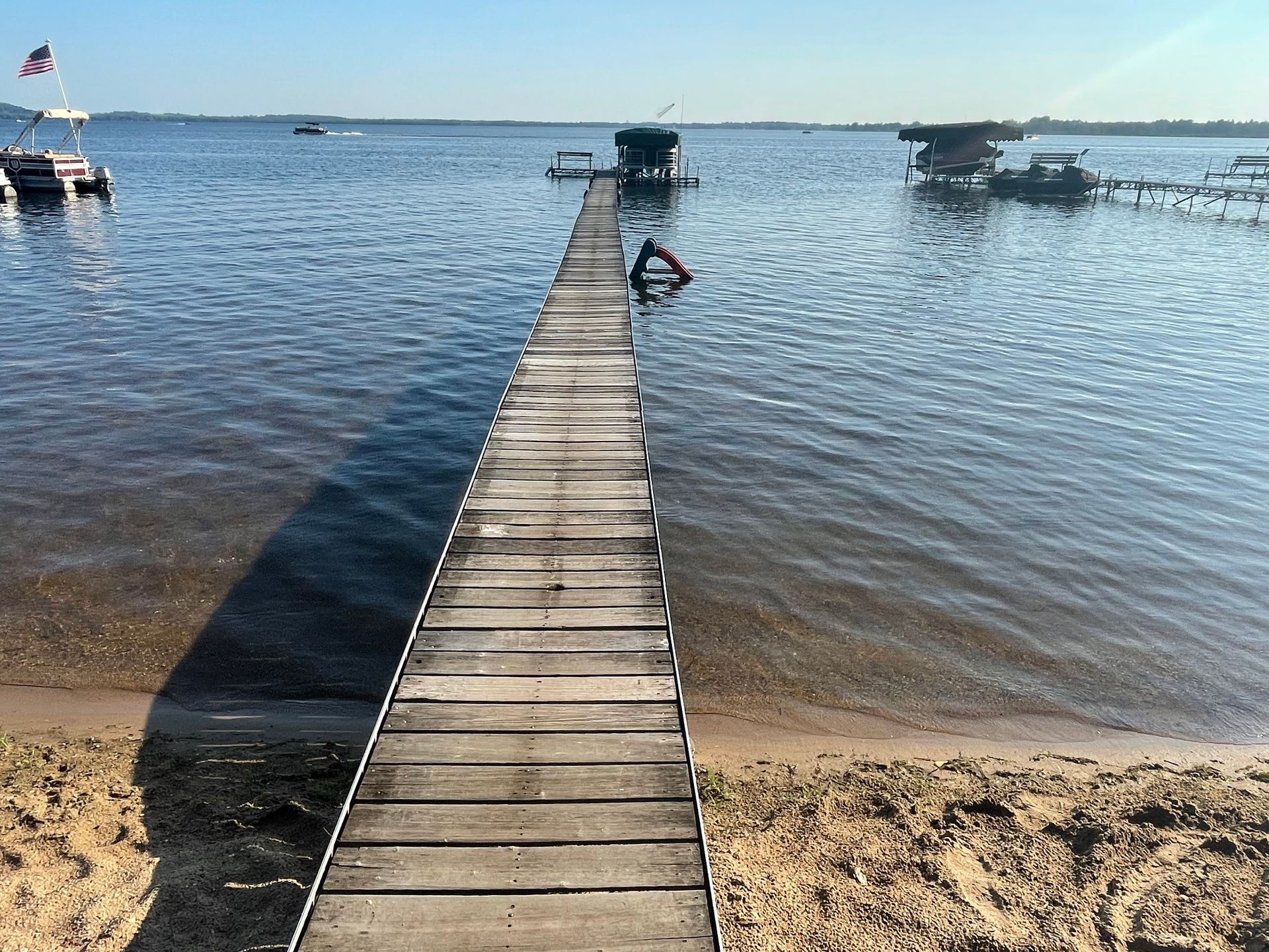 A wooden dock leading into a body of water.
