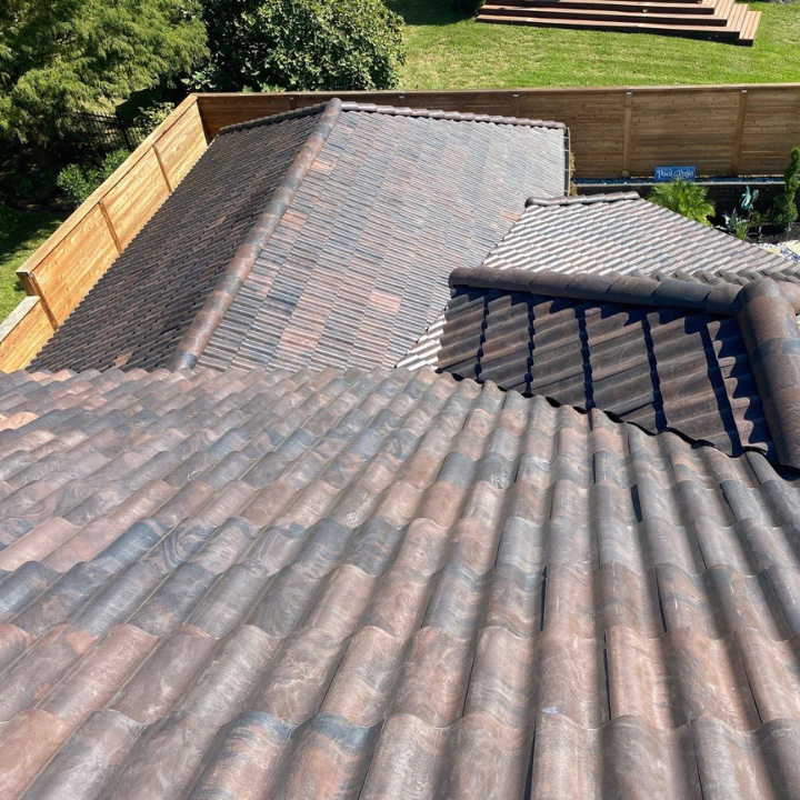 Truework professional assessing how much a residential roof replacement costs in Houston