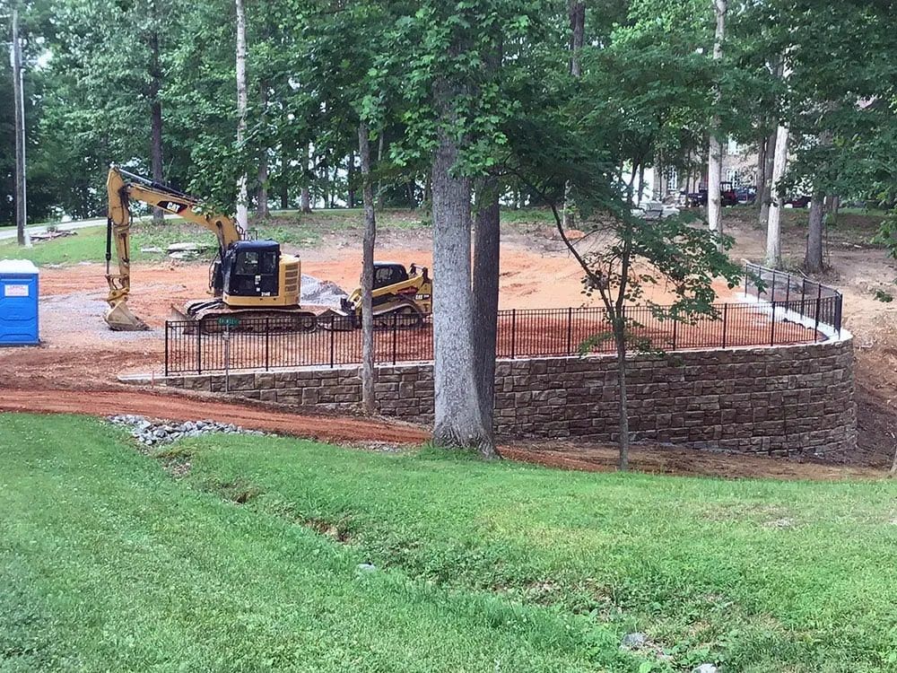 A construction site with a bulldozer in the middle of it.