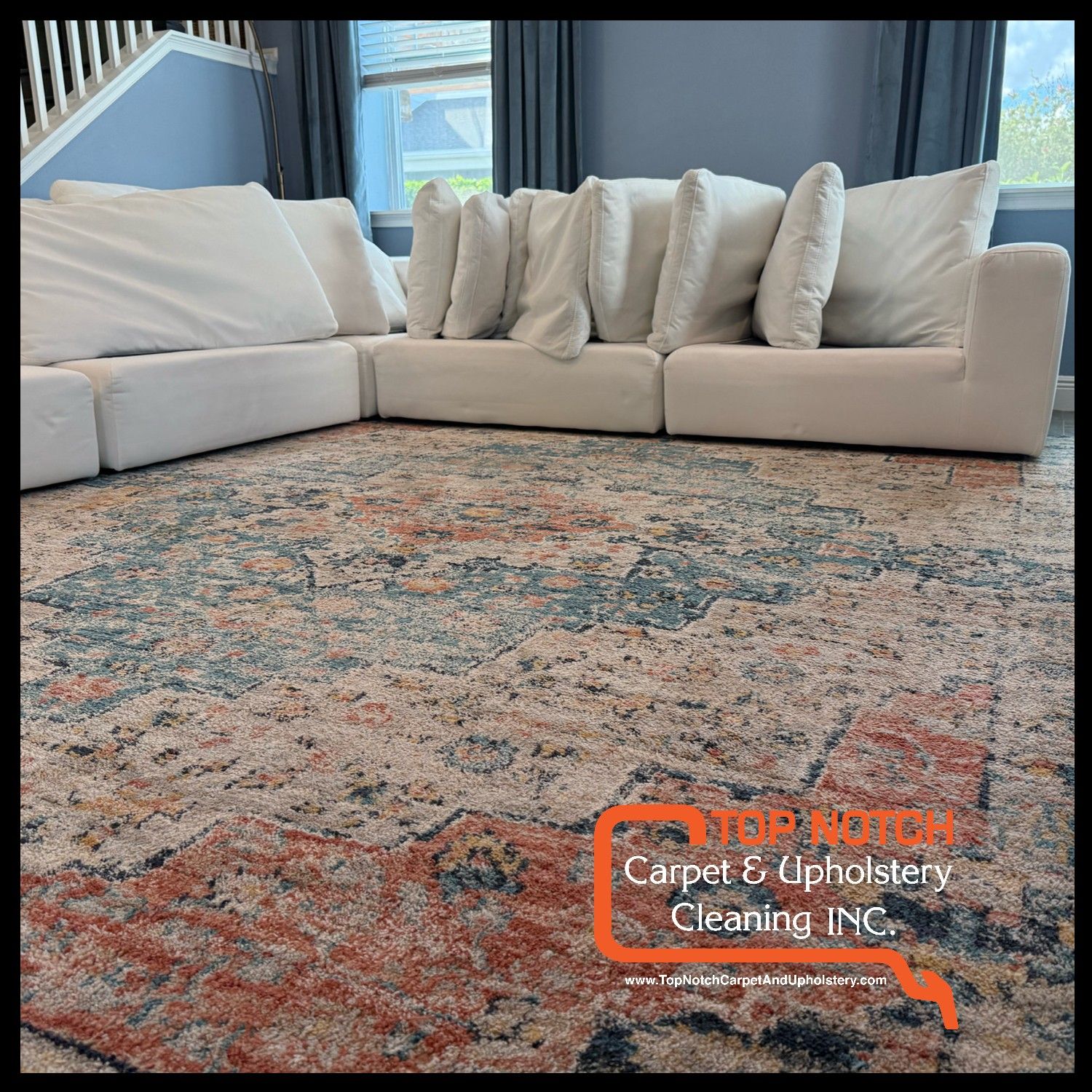 White sectional sofa on a patterned rug; blue walls, window curtains, and STEPS AHEAD Carpet & Upholstery Cleaning Inc. logo.