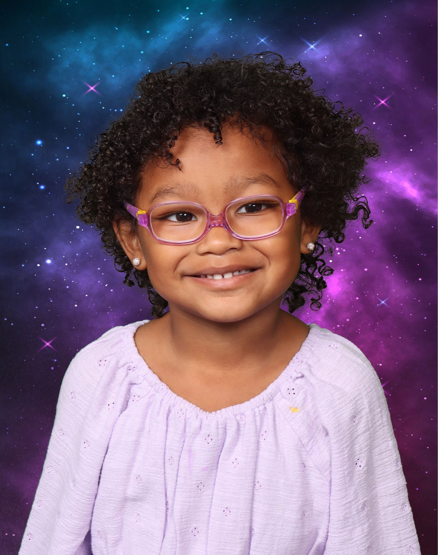 A little girl wearing glasses and a purple shirt