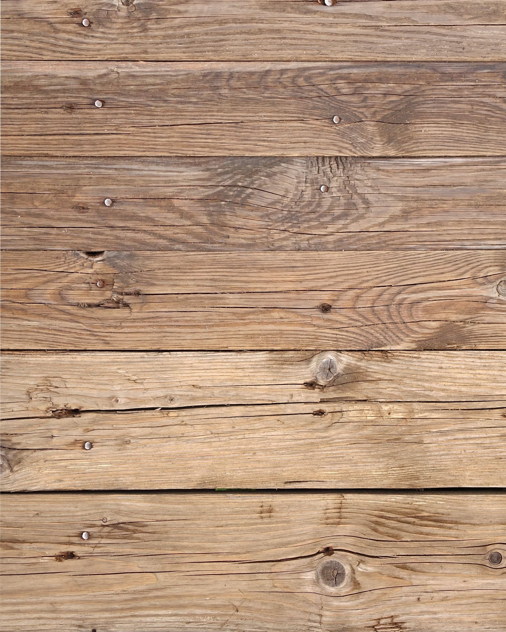 A close up of a wooden floor with a lot of grain