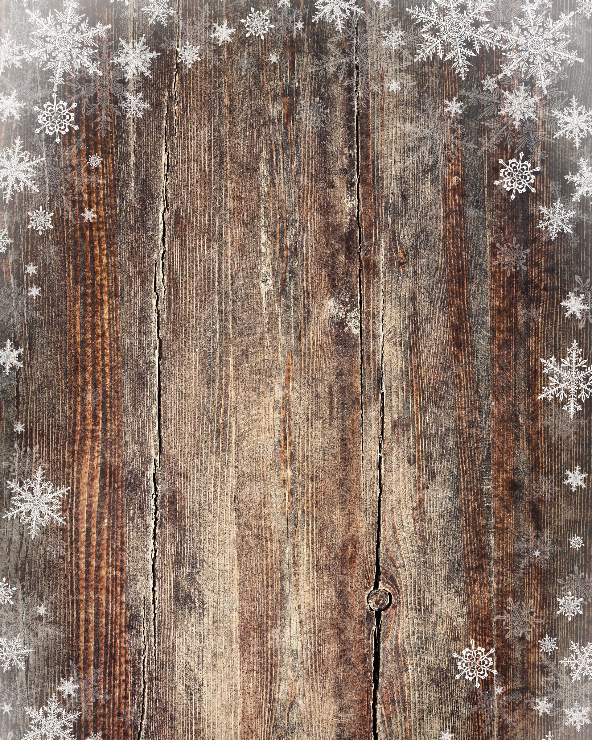 A wooden background with snowflakes on it