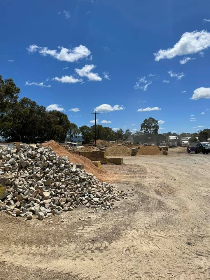 A Pile of Rocks is Sitting in the Middle of a Dirt Field — Wodonga Sand & Soil in Wodonga, VIC