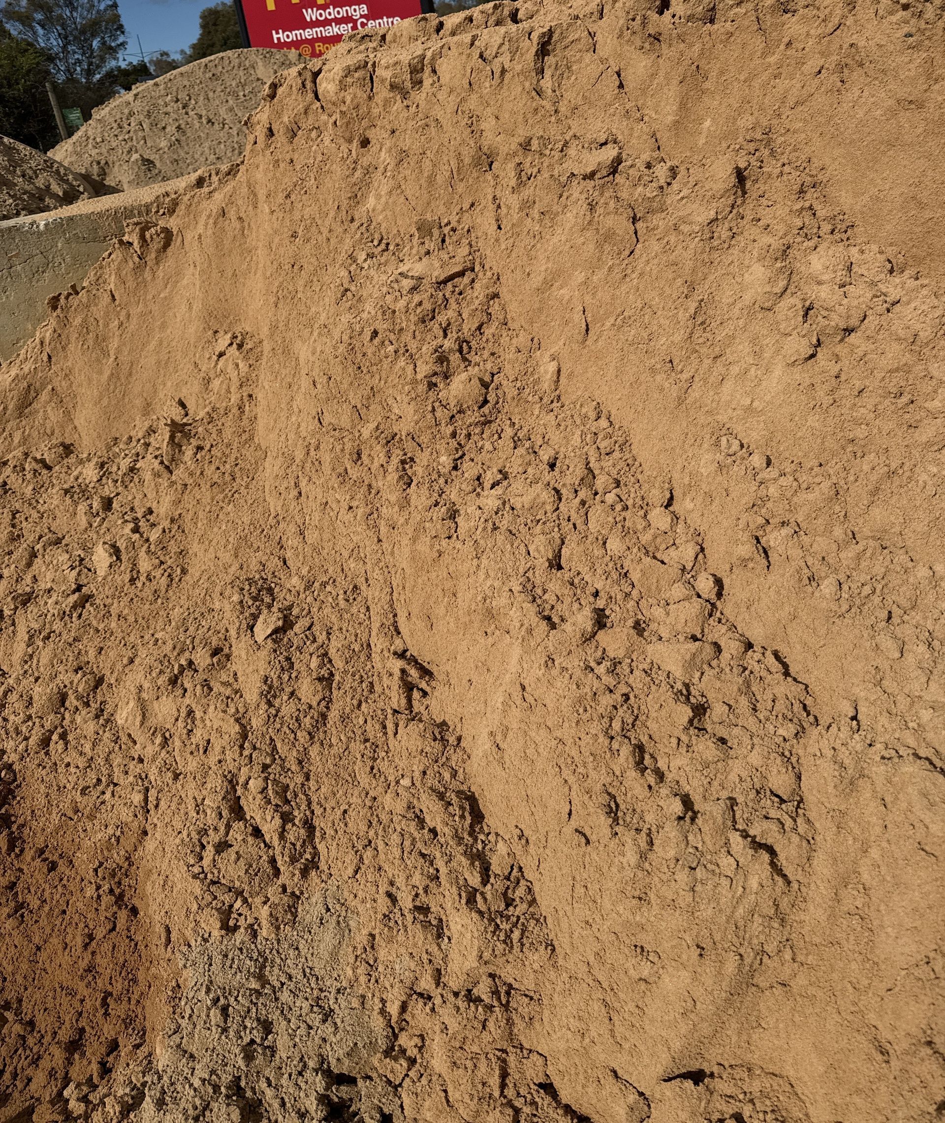 A large pile of light brown sand, likely for construction or landscaping. — Wodonga Sand & Soil in Wodonga, VIC