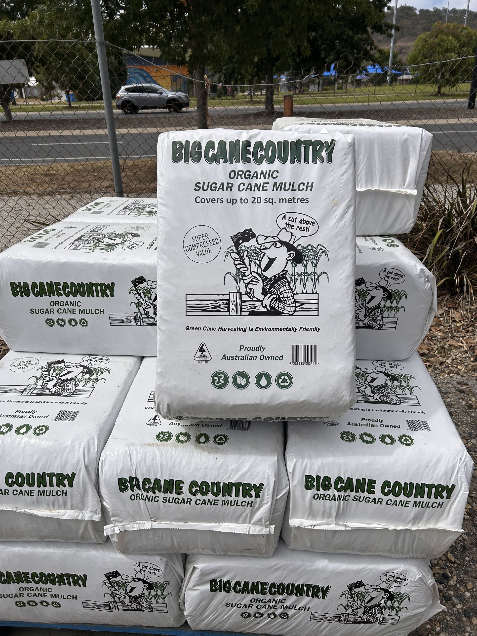 A Bunch of Bags of Dirt Are Stacked on Top of Each Other on a Pallet — Wodonga Sand & Soil in Wodonga, VIC