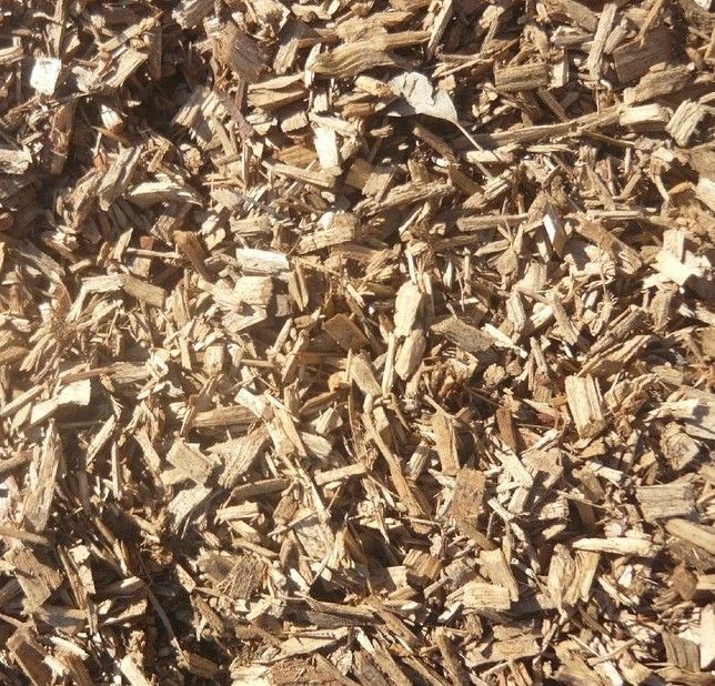 There is a Large Pile of Wood Chips in the Middle of a Field — Wodonga Sand & Soil in Wodonga, VIC