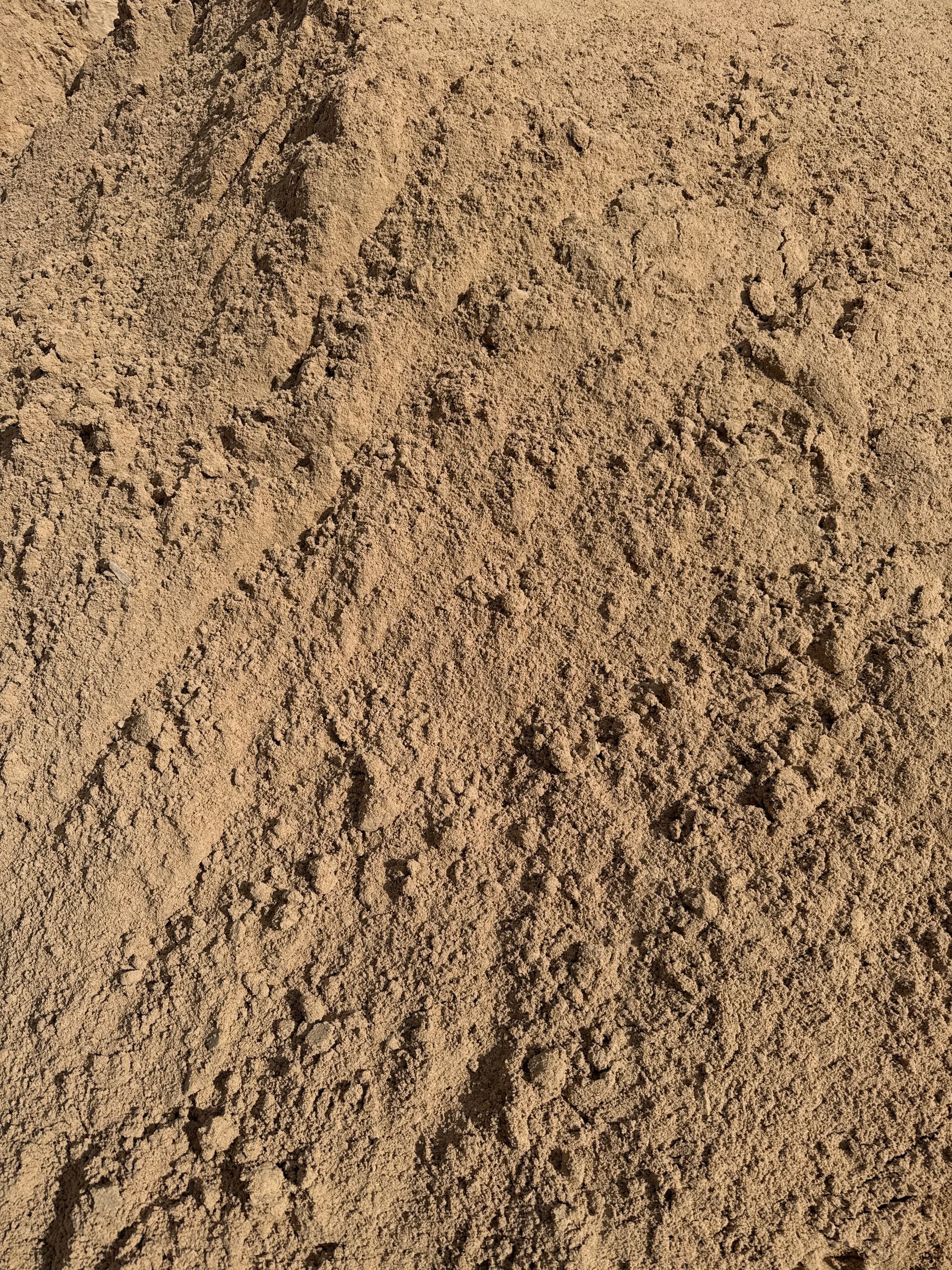 Close-up of a pile of tan-colored sand or soil, with a rough and textured surface. — Wodonga Sand & Soil in Wodonga, VIC