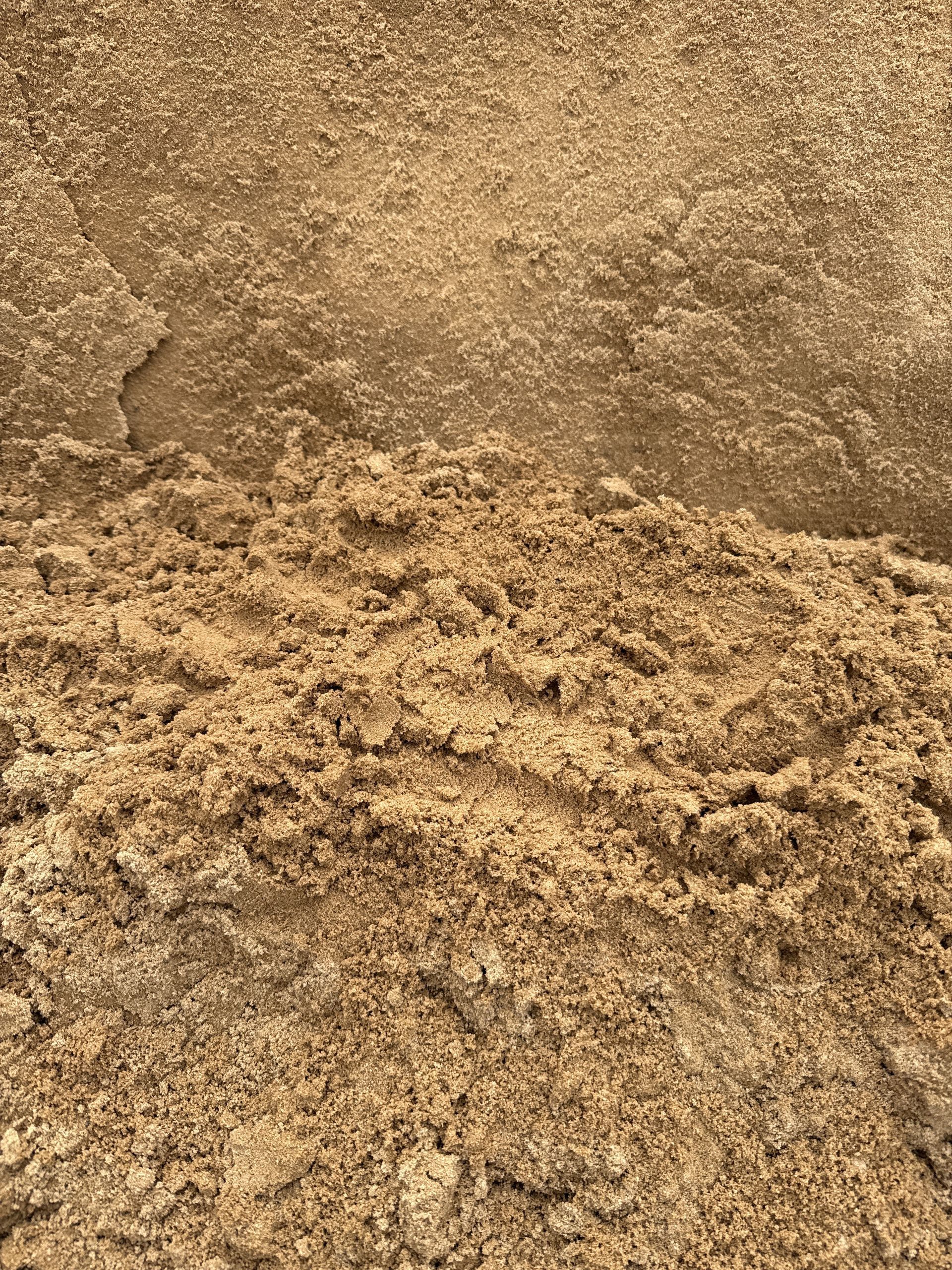 Close-up view of a pile of light brown, grainy material, possibly sand or soil. — Wodonga Sand & Soil in Wodonga, VIC